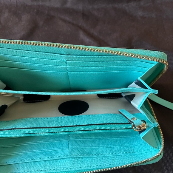 Kate spade tote with inside zipper pocket and two pockets on other side. - Picture 13 of 14
